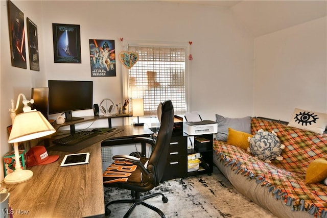 home office with lofted ceiling