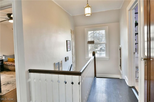 foyer entrance featuring dark hardwood / wood-style flooring, vaulted ceiling, and ceiling fan