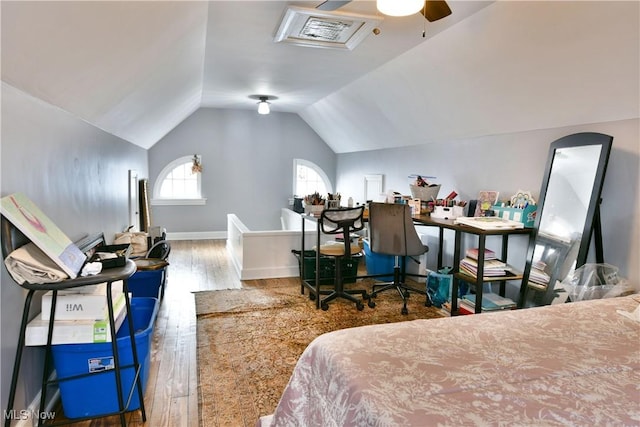 bedroom featuring hardwood / wood-style flooring and vaulted ceiling