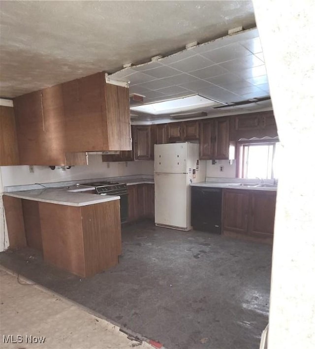 kitchen with sink, range with electric stovetop, and white fridge