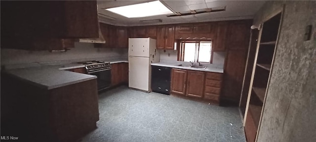 kitchen featuring stainless steel range, black dishwasher, sink, and white fridge