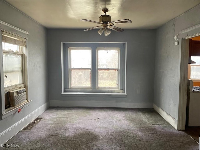 spare room featuring cooling unit, ceiling fan, and carpet floors