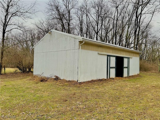 view of outdoor structure with a yard