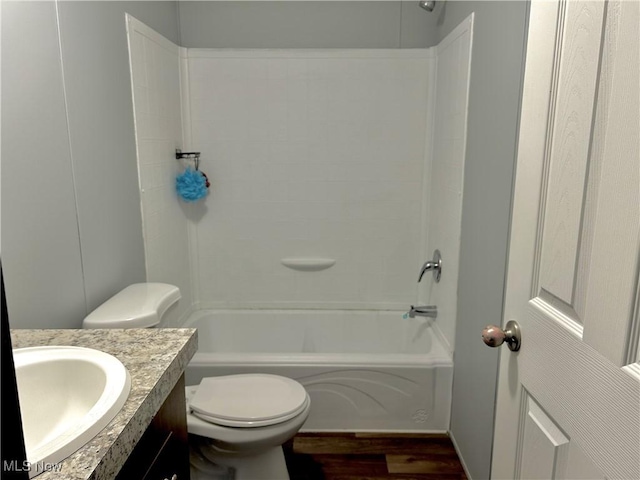 full bathroom with vanity, wood-type flooring, bathing tub / shower combination, and toilet