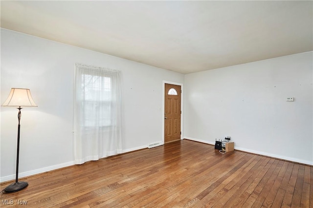 foyer entrance with light hardwood / wood-style floors