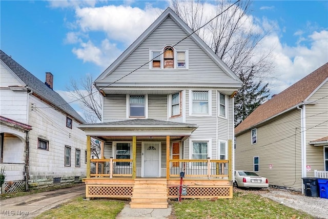 view of property featuring covered porch