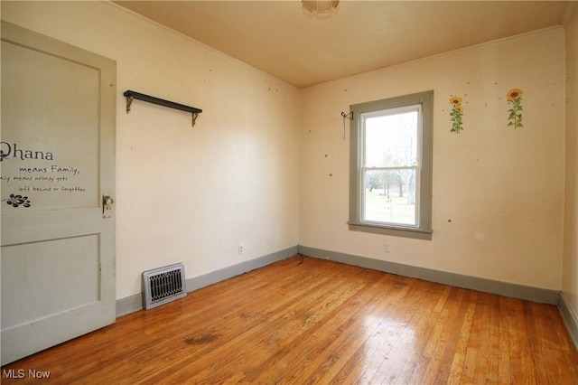 unfurnished room featuring light hardwood / wood-style flooring