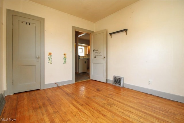 spare room featuring light wood-type flooring