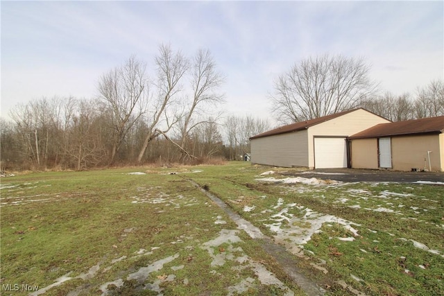 view of yard with a garage