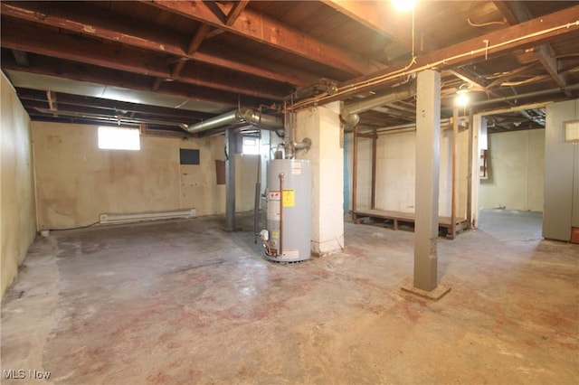 basement featuring water heater and a baseboard heating unit