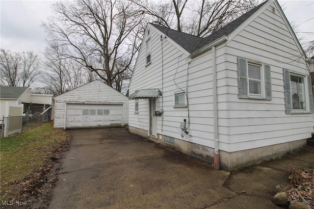 view of home's exterior with an outbuilding and a garage