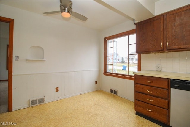 kitchen with tasteful backsplash, ceiling fan, and dishwasher