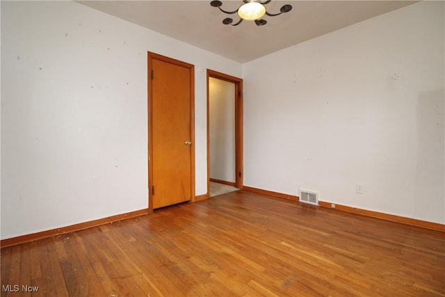 unfurnished room featuring light hardwood / wood-style floors