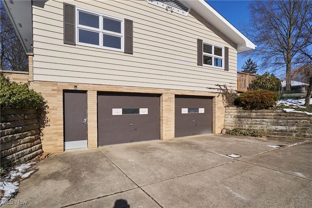 view of side of home with a garage