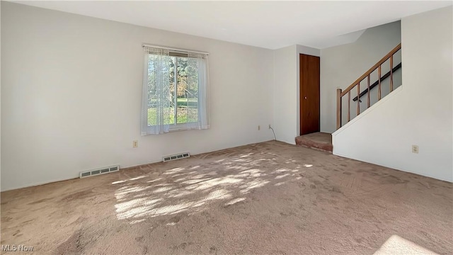 5540 Wrens Ln Unit 26D, Willoughby, OH 44094 - unfurnished living room featuring carpet flooring and stairway