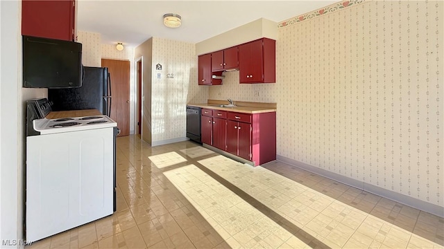 5540 Wrens Ln Unit 26D, Willoughby, OH 44094 - kitchen featuring wallpapered walls, black appliances, red cabinetry, a sink, and baseboards