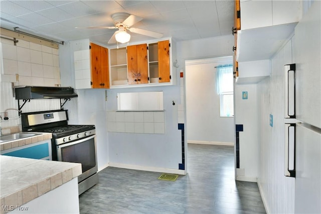 kitchen with white cabinetry, sink, dark hardwood / wood-style floors, and gas stove