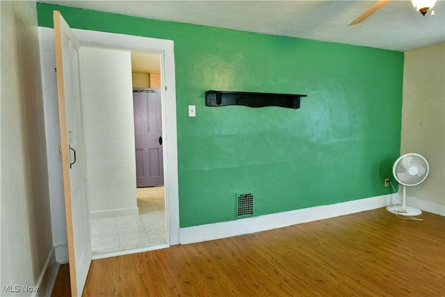 interior space with ceiling fan and light wood-type flooring