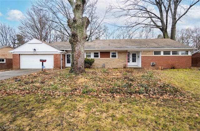 view of front of property with a garage and a front yard