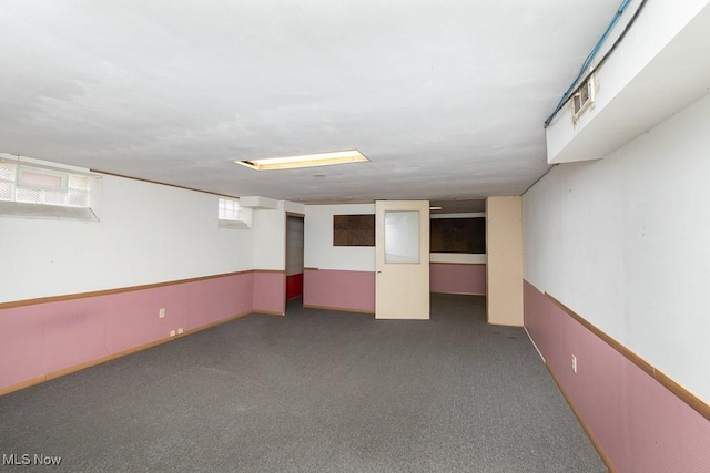 basement with dark carpet