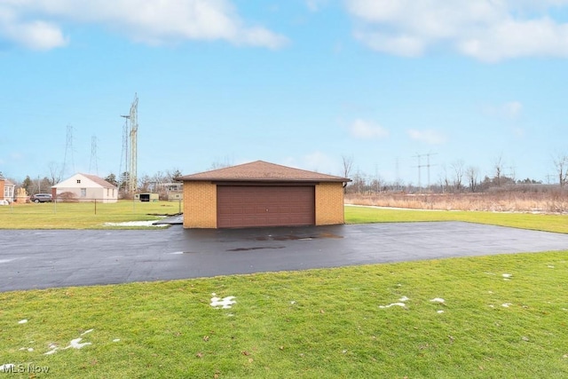 garage featuring a yard