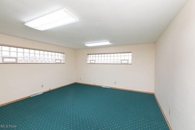 unfurnished room with carpet flooring