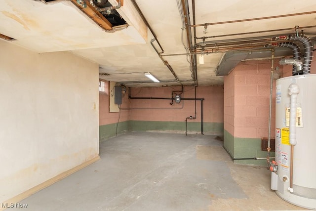 basement featuring water heater and electric panel