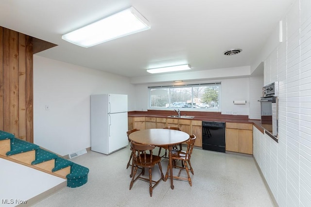 kitchen featuring sink and black appliances