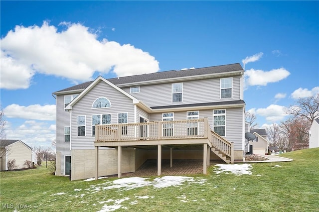 back of house featuring a wooden deck and a yard