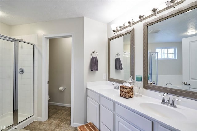 bathroom featuring vanity, an enclosed shower, toilet, tile patterned floors, and a textured ceiling