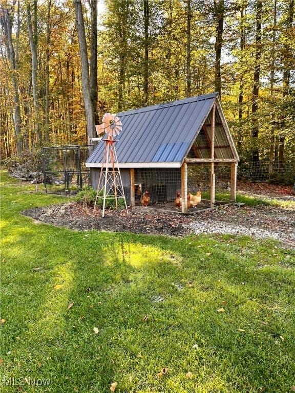 view of outdoor structure with a yard