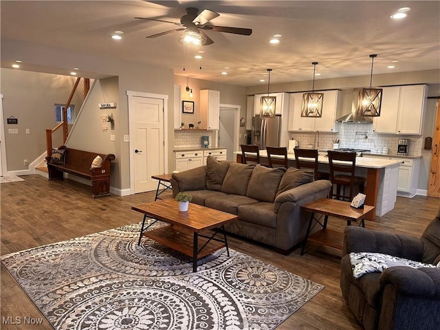 living room featuring dark hardwood / wood-style floors and ceiling fan