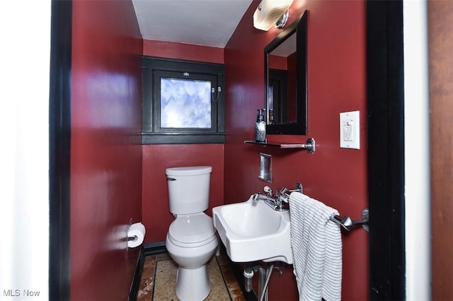 bathroom featuring sink and toilet