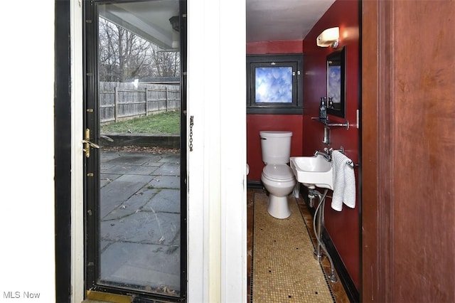 bathroom with toilet and sink