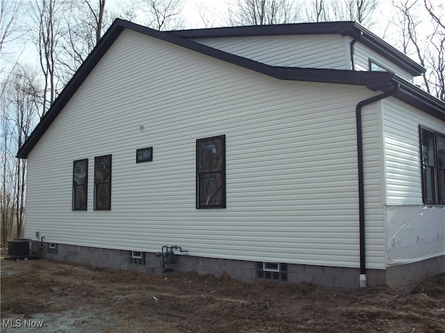 view of property exterior with central AC