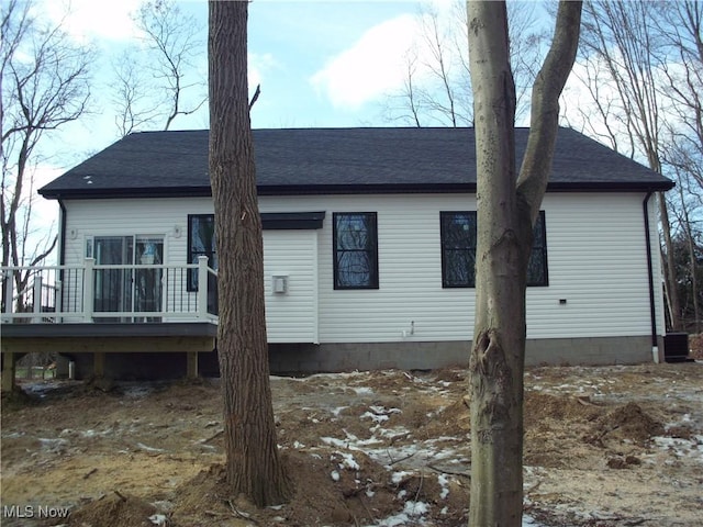 back of house featuring a deck