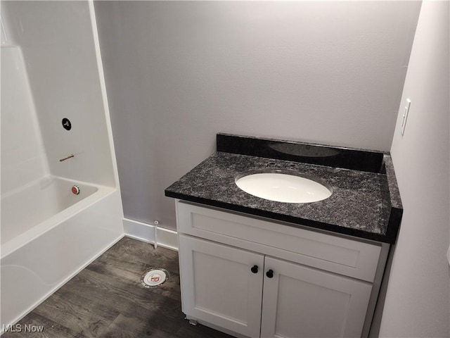 full bathroom featuring vanity and wood finished floors