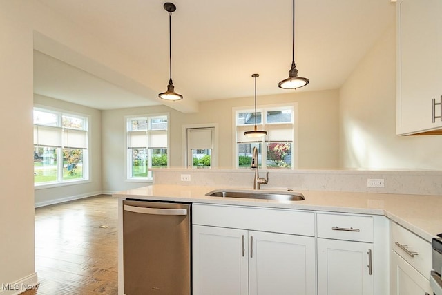 kitchen with white cabinetry, sink, and dishwasher