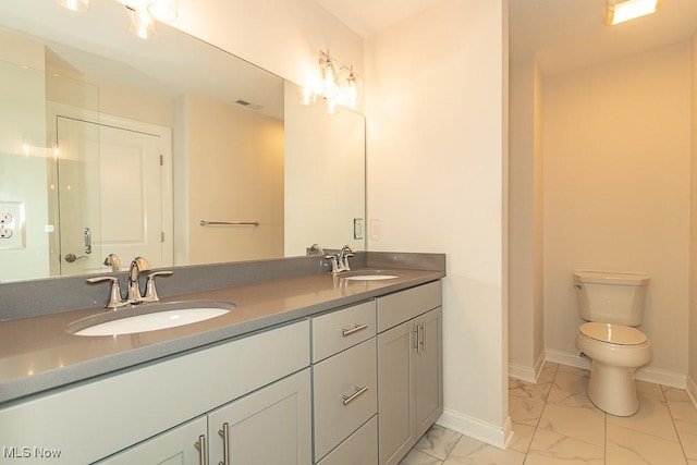 bathroom with vanity and toilet