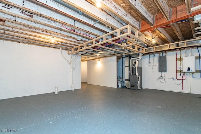 basement featuring heating unit and electric panel