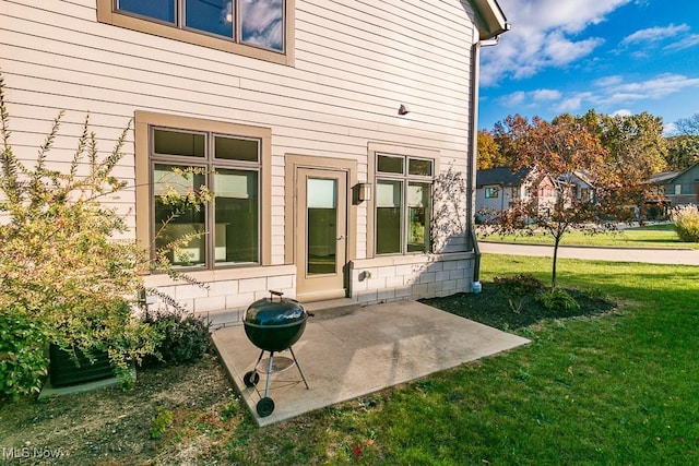 exterior space with a yard and a patio area