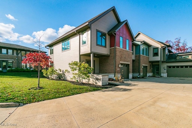 view of front of home with a garage and a front yard