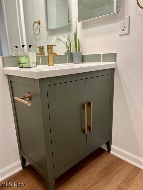 bathroom featuring hardwood / wood-style floors and vanity