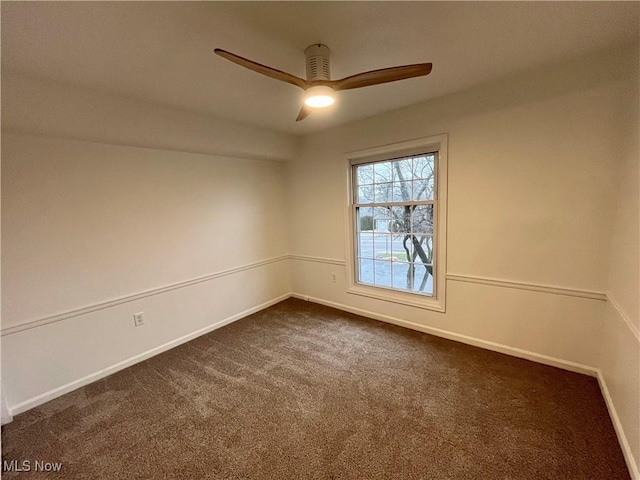 carpeted empty room featuring ceiling fan