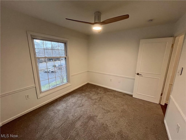 carpeted empty room featuring ceiling fan