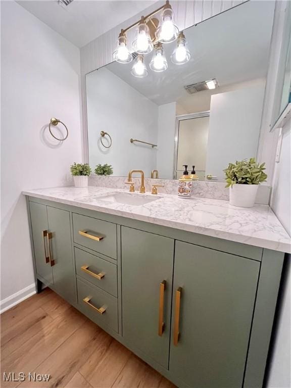 bathroom featuring vanity and hardwood / wood-style floors