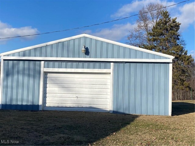 garage with a yard