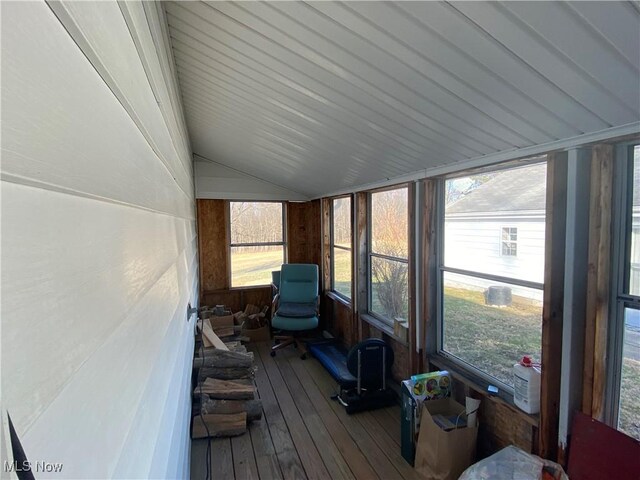 sunroom featuring lofted ceiling