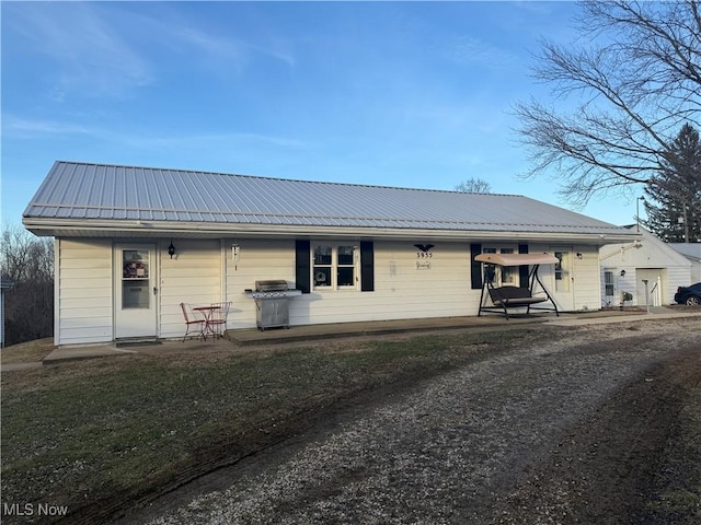 view of front of property featuring metal roof