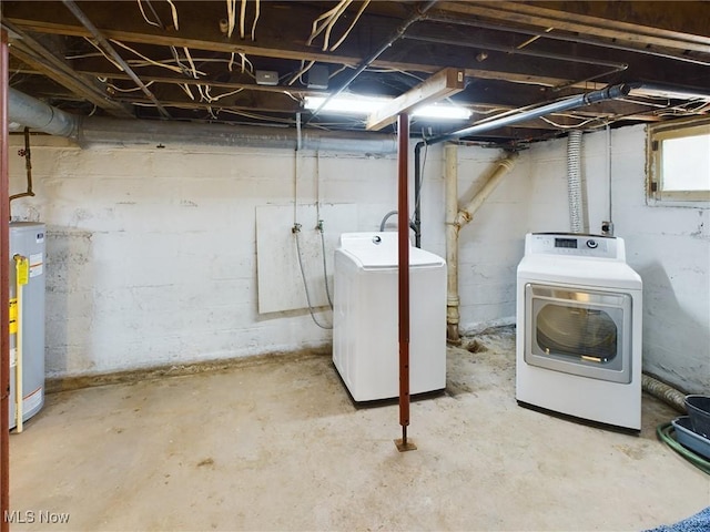 basement with washer and clothes dryer and gas water heater